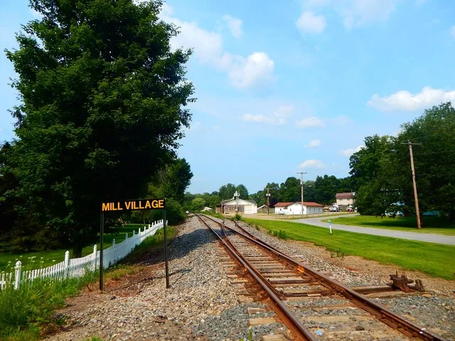 Location of the former Mill Village station along the Erie Railroad Meadville division in Mill Village , Pennsylvania . Photo taken at the North Main Street railroad crossing look...