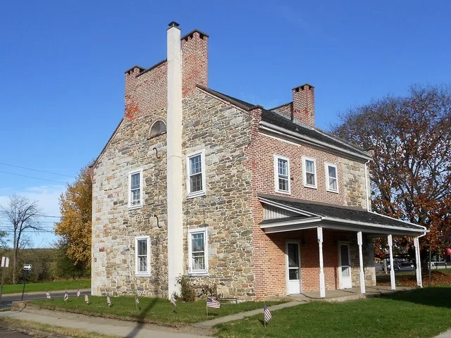 House in Nescopeck, Pennsylvania on 3rd Street (PA 93) and Cooper St. In front of the empty lot next door is a Pennsylvania State Historical Marker (PHMC) saying that Peter Fredri...