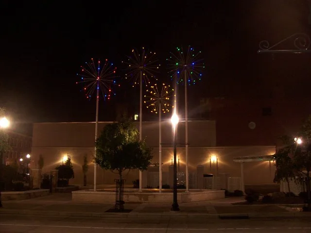 Zambelli Plaza at night with the fireworks lit up.