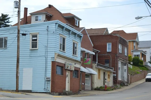 Buildings on the southern side of Romine Avenue, seen looking west from the Brushton Street intersection, in Port Vue , Pennsylvania , United States .