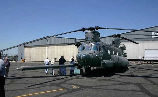 Boeing employees observe the company's newest aircraft, the MH-47G Chinook helicopter, during the aircraft's rollout ceremony May 6 at Ridley Park, Pa.