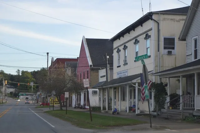 Buildings on the western side of Main Street ( Pennsylvania Route 173 ) south of Lacock Street in central Sandy Lake , Pennsylvania , United States .