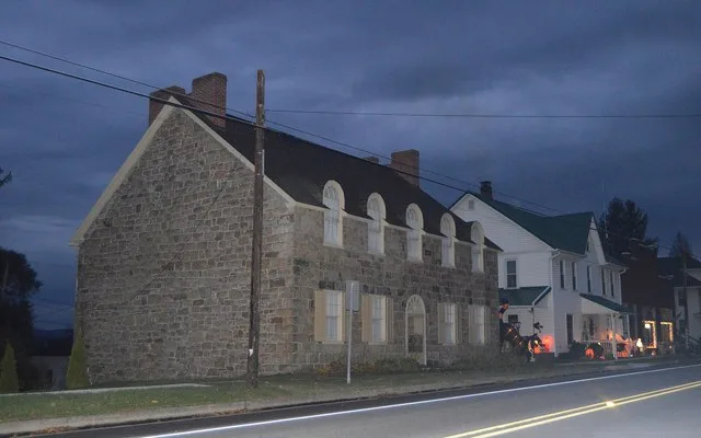 Houses on the southern side of E. Pitt Street ( U.S. Route 30 ) in Schellsburg , Pennsylvania , United States . This block is part of the Schellsburg Historic District , a histori...