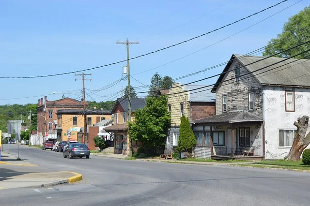 Buildings on the northern side of Bald Eagle Street ( Pennsylvania Route 58 ), seen looking west from the Colerain Street intersection, in Sligo , Pennsylvania , United States .