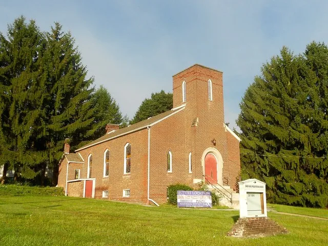 The former Presbyterian church in Snow Shoe, Centre County, Pennsylvania. If the sign in front is to be believed it will become a dentist's office.