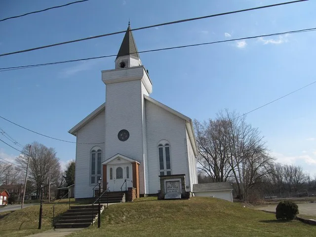 Front of the Spartansburg United Methodist Church, located at 100 Main Street ( Pennsylvania Route 77 ) in Spartansburg , Pennsylvania , United States .