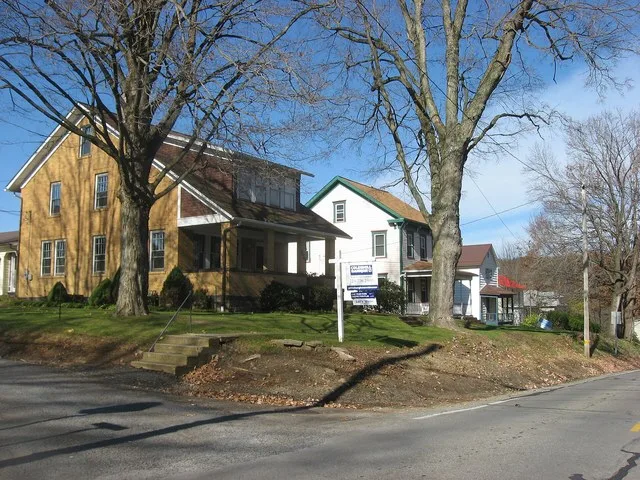 Houses on the western side of Main Street ( Pennsylvania Route 58 ) at the Third Street intersection in St. Petersburg , Pennsylvania , United States .