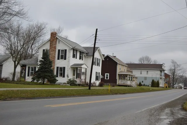 Houses on the northern side of Main Street ( U.S. Route 322 ) in Strattanville , Pennsylvania , United States , seen looking east from the Ridge Avenue intersection.