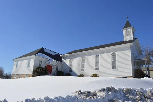 Southern side and front of St. John's Lutheran Church, located at the junction of Main and Croyle Streets in Summerhill , Pennsylvania , United States .