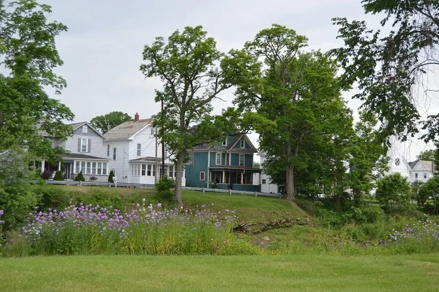 Houses on Church Street east of Third Avenue, seen from Water Street on the other side of Redbank Creek , in Summerville , Pennsylvania , United States .