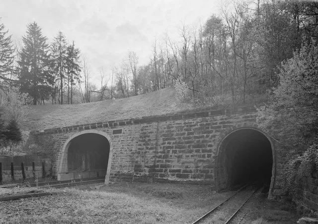Trimmed black borders and formatted as a jpg file from File:Perspective view of east portal, looking WSW. Allegheny tunnel at left; Gallitzin tunnel (HAER no. PA-516) at right. -...