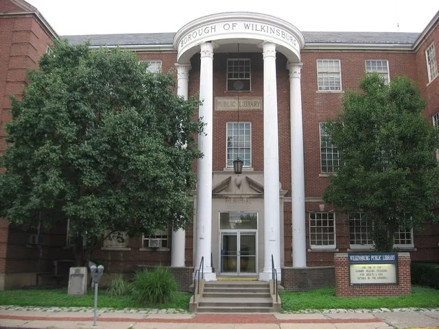 Entrance to the municipal building and library of Wilkinsburg , a borough on the eastern edge of Pittsburgh , Pennsylvania , United States . Address 605 Ross Avenue; picture taken...