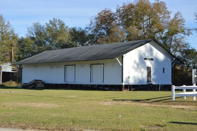 Northern side and western end of the former train station in Tatum , South Carolina , United States , seen from Main Street ( U.S. Route 15 ).