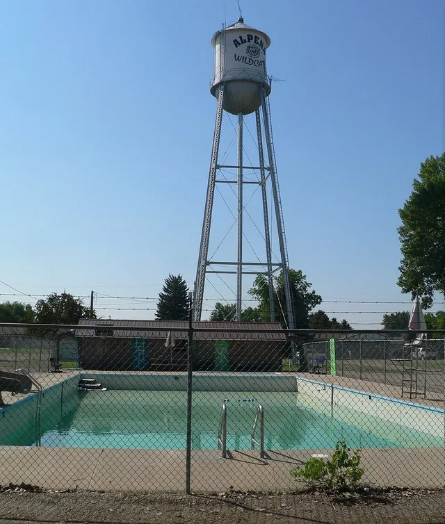 Swimming pool and water tower in Alpena, South Dakota; seen from the north.