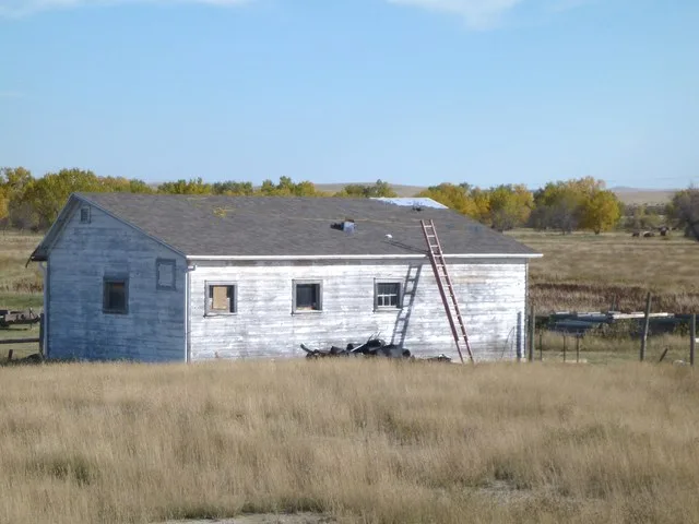 Barn with new roof almost complete. 10-07-2010. Camp Crook, SD 57724. The Recovery Act has provided funding for construction of a new Sioux Ranger District office in Camp Crook, S...