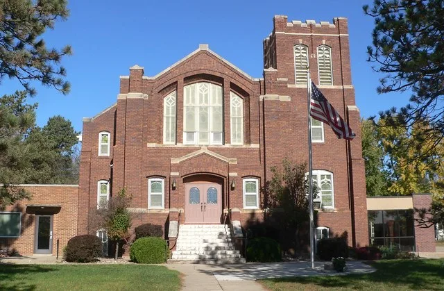 Vangen Lutheran Church, on north side of 3rd Street (county road 308th Street) in northwestern Mission Hill, South Dakota; seen from the south.