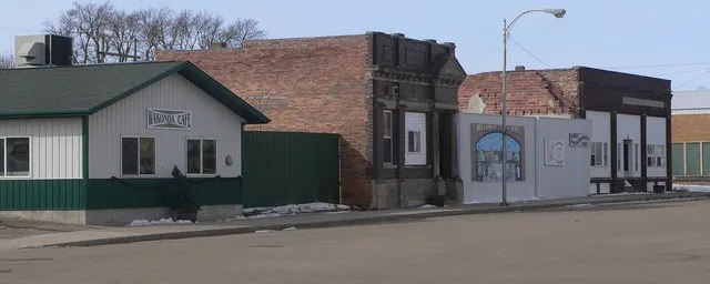 Southwest side of Ohio Street between 1st and 2nd Streets in Wakonda, South Dakota. Camera is facing generally westward from near the intersection of 2nd and Ohio. Near the center...