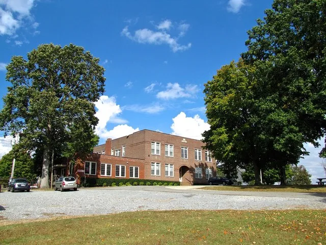 The former Bell School in Adams, Tennessee, United States. The building now houses municipal offices. The addition on the left is home to Moss Restaurant.