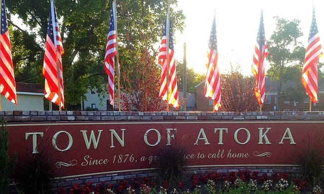 This Town of Atoka sign is located at the three-way stop in downtown Atoka, Tennessee where Atoka-Munford Avenue dead-ends into Main Street.