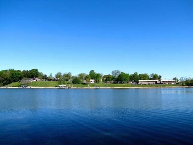 View across Tims Ford Lake (Elk River) toward Estill Springs, Tennessee, United States (Estill Springs Nazarene Church on the right).