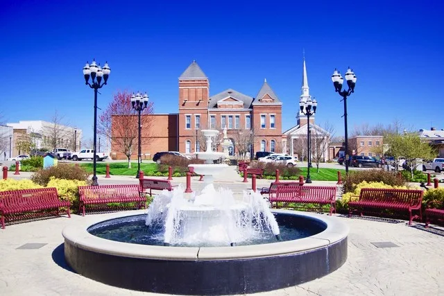Fountain on the courthouse square in McMinnville, Tennessee, United States, with the Warren County Courthouse rising in the background.