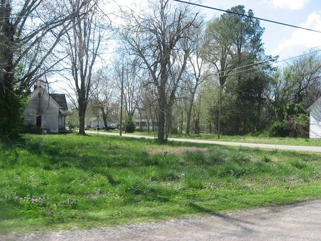 Site of Dickey's Octagonal Barbershop , located on the southwestern corner of the junction of Church and High Streets in Rives , Tennessee , United States . Built in 1894, it was...
