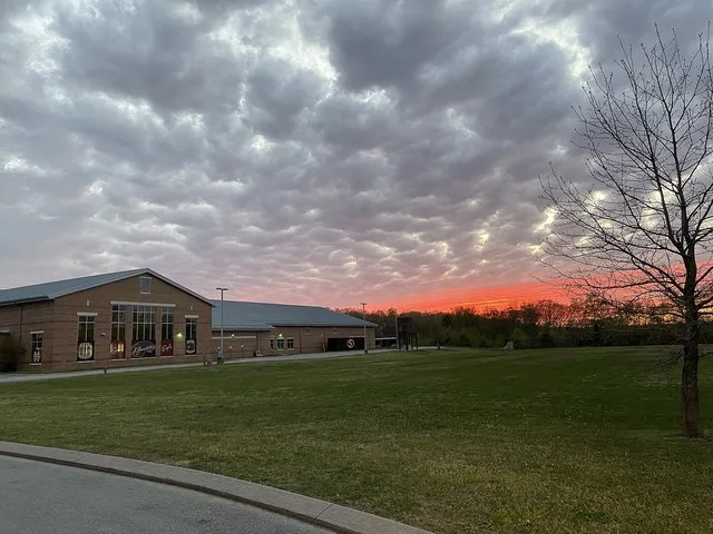 This is a photograph depicting the back of Signal Mountain High School in front of a nice sunset on Signal Mountain, Tennessee