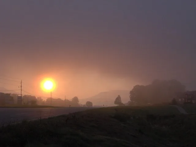 Sunrise over U.S. Route 321 in Townsend, Tennessee (Tuckaleechee Cove). Rich Mountain, in the Great Smokies, is visible in the distance. Fog from the mountains often hangs over th...