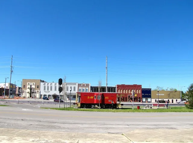 Buildings along Atlantic Avenue in downtown Tullahoma, Tennessee , United States, with L&N 1092 caboose on display in the foreground