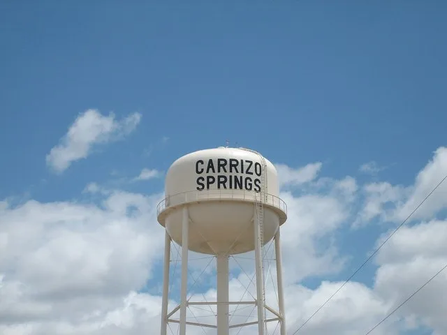 black-on-white-painted water tower at Carrizo Springs, Texas