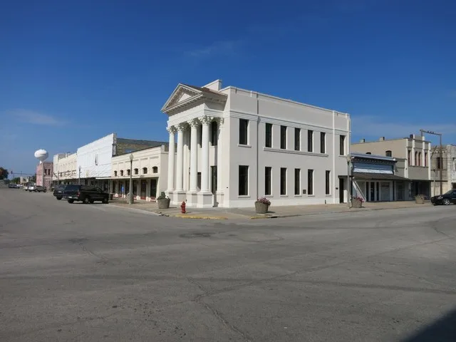 Photo shows buildings in the old business district at N. Washington and E. Monseratte Streets in El Campo, Texas. View is toward the southwest.