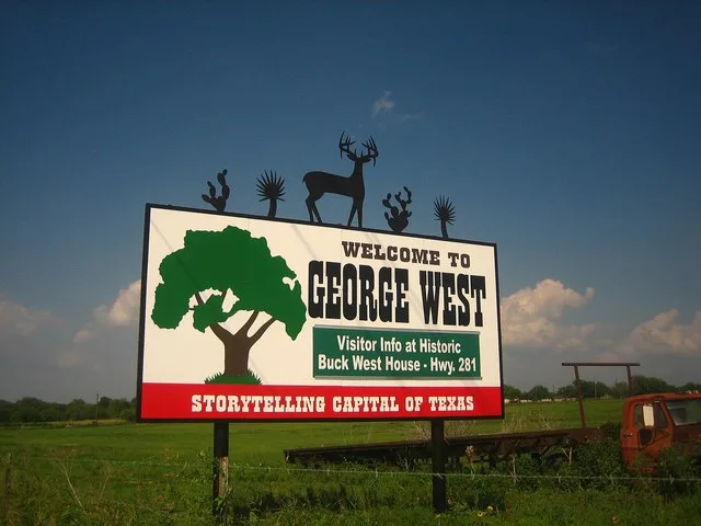 city welcome sign at the southwest end of George West, Texas , on U.S. Route 59 headed northeast