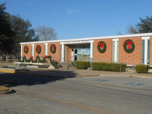The Gonzales, Texas Municipal Building was built on St. Joseph St. in 1959. It was designed in a mid-century modern style by Emil Niggli and Barton D. Riley, architects.