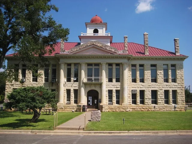 Blanco County Courthouse at Johnson City, Texas. The classical revival limestone structure, was built in 1916.
