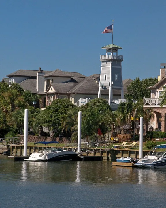 Boats tied up at private docks at South Shore Harbor in League City, TX