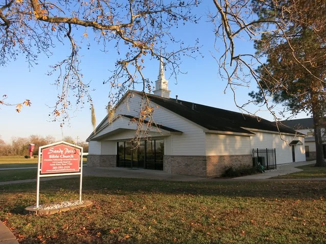 Photo shows the Sandy Point Bible Church at 119 County Road 42 near Farm to Market Road 521 in Sandy Point, Texas. View is toward the southeast.