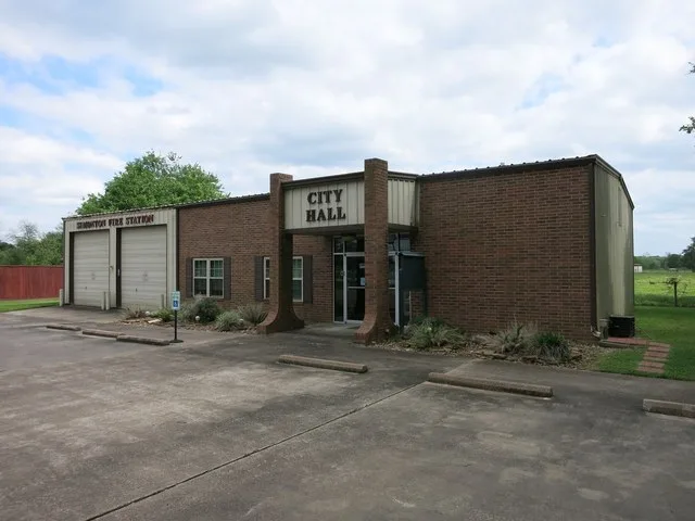 Photo shows the City Hall at 35011 FM 1093 in Simonton, Texas. Sharing the building is Fire Station No. 2 of the Fulshear-Simonton Fire Department. View is toward the southeast.