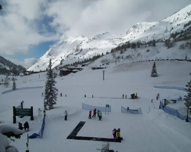 Children taking skiing lessons at Alta Ski Area in Utah .