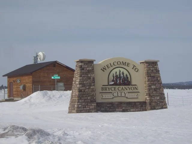 Welcome sign for the town of Bryce Canyon City , Utah , United States .