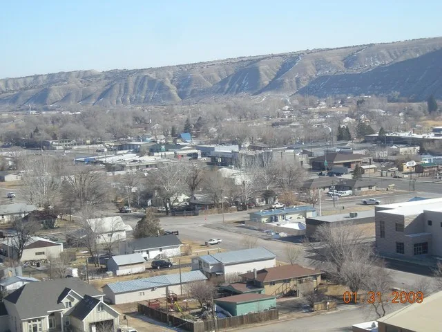 Duchesne Utah from the top of the west bench water tank. The buildings in the center of the picture are the old Kohls market and Commercial Club.