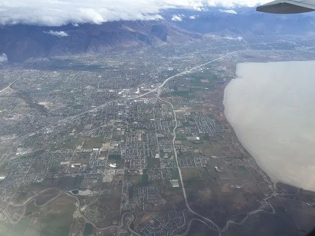 View from an airplane of the cities of Lehi, American Fork, Pleasant Grove, Lindon and Orem, Utah along Interstate 15 and the northeast shore of Utah Lake