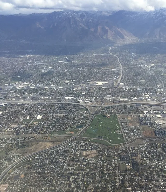 View east from an airplane along the southern portion of Interstate 215 as it crosses the cities of Taylorsville, Murray and Midvale, Utah and interchanges with Interstate 15