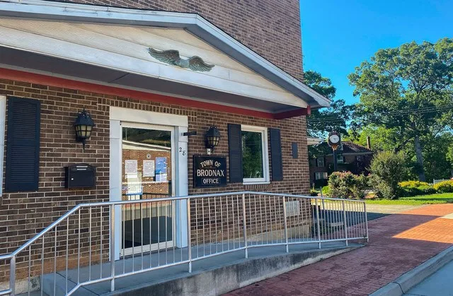 The town building on Main Street across from the Railway Atlantic and Danville Railway Depot and an old building no longer in use.