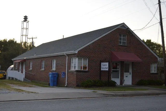 Front and southern side of the Capron town hall, located on Main Street north of the railroad line in Capron , Virginia , United States .