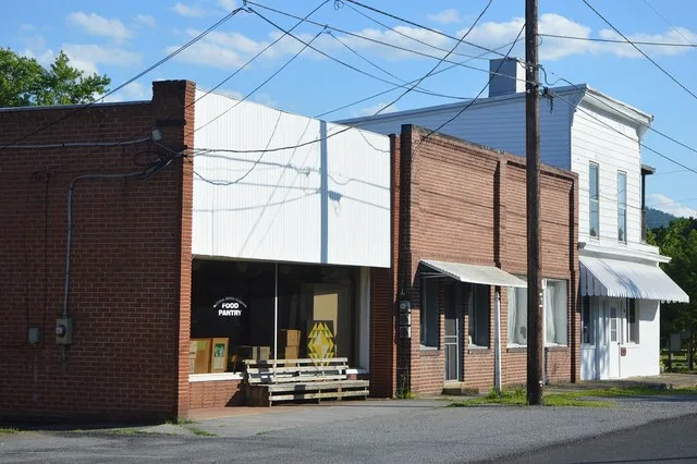 Commercial buildings on the southeastern side of McCullough Street, northeast of Blue Ridge Road, in Glasgow , Virginia , United States . This block is part of the Glasgow Histori...
