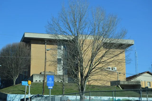 Western end of the Lee County Courthouse , located at the intersection of Park ( U.S. Route 58 ) and Main Streets in downtown Jonesville , Virginia , United States .