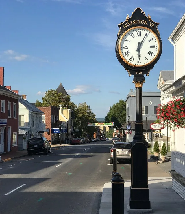 View of South Main Street, looking north, in Lexington, Virginia . Features a city street clock with the year 1778.