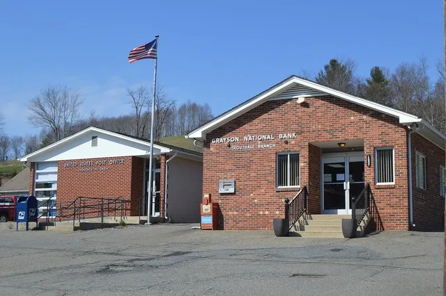 Front of the Troutdale post office and bank, located on Ripshin Road at Troutwood in Grayson County , Virginia , United States .