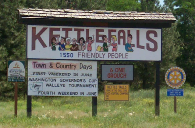 This is a photograph of the welcome sign at the northwestern entrance of Kettle Falls .