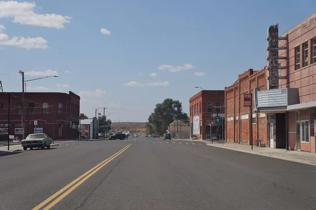 Looking westbound on East 2nd Avenue ( State Route 21 ) in downtown Lind, Washington . The Empire Theater is on the right.